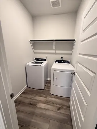 a utility room with dryer and washer