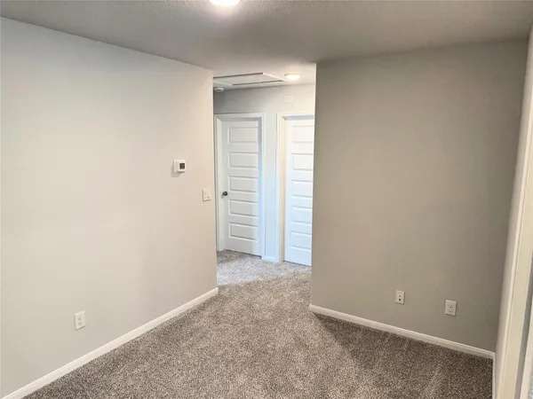 an empty room with closet area