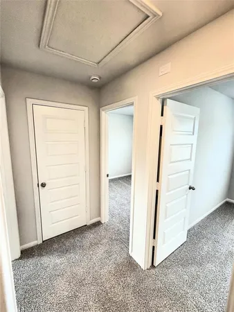 a view of an empty room and a window