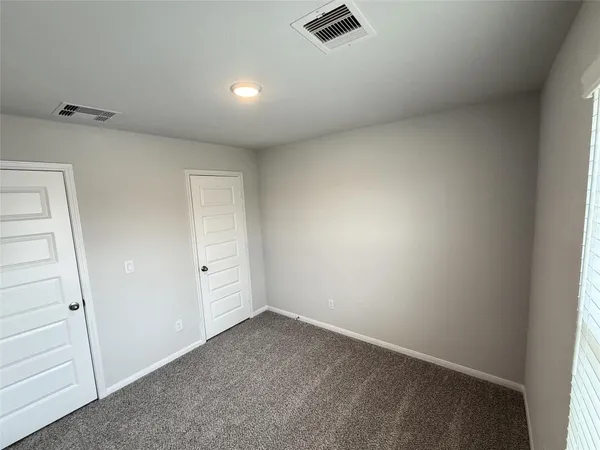 an empty room with cabinet