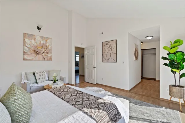 a bedroom with a bed and a couch