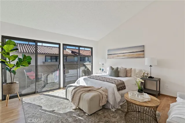 a bedroom with a bed and a table