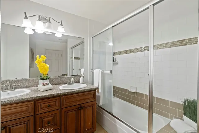 a bathroom with a double vanity sink mirror and double