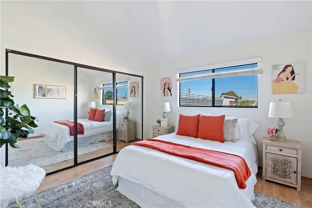 a bedroom with a bed and a couch