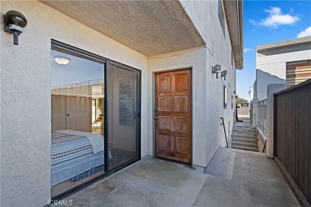 a view of a hallway with wooden shelves