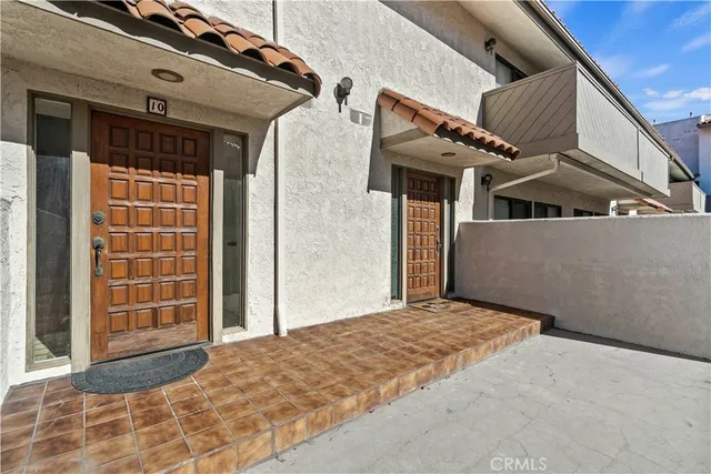 a view of a white house with a large windows