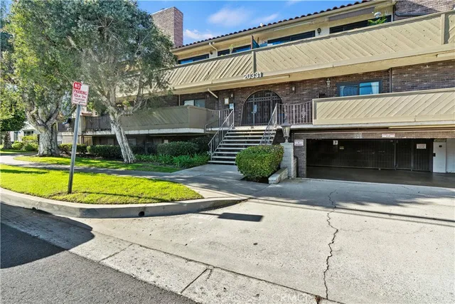 a view of parking garage with cars parked
