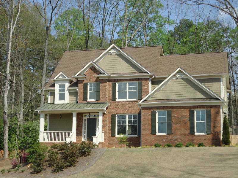 5915 Windjammer Point Cumming, GA 30041 - Photo 1 of 1 Exterior Front. Impressively sitting well back from the street with a long driveway and a side entry garage. (an option for a 3rd car detached garage is possible). This new home has a fenced back yard.