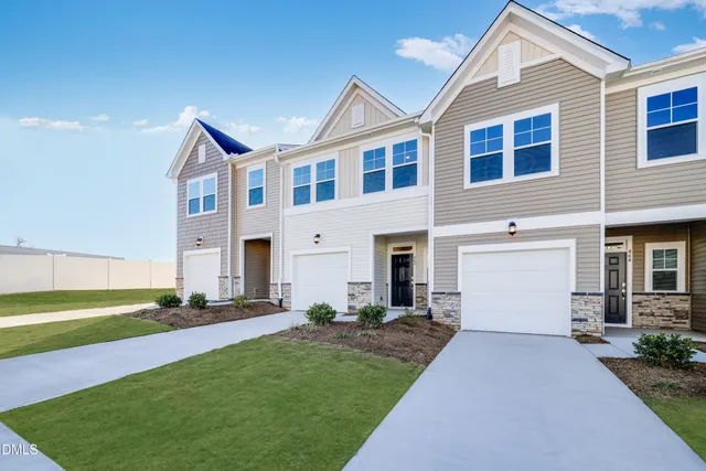 a kitchen that has a sink and a stove top oven