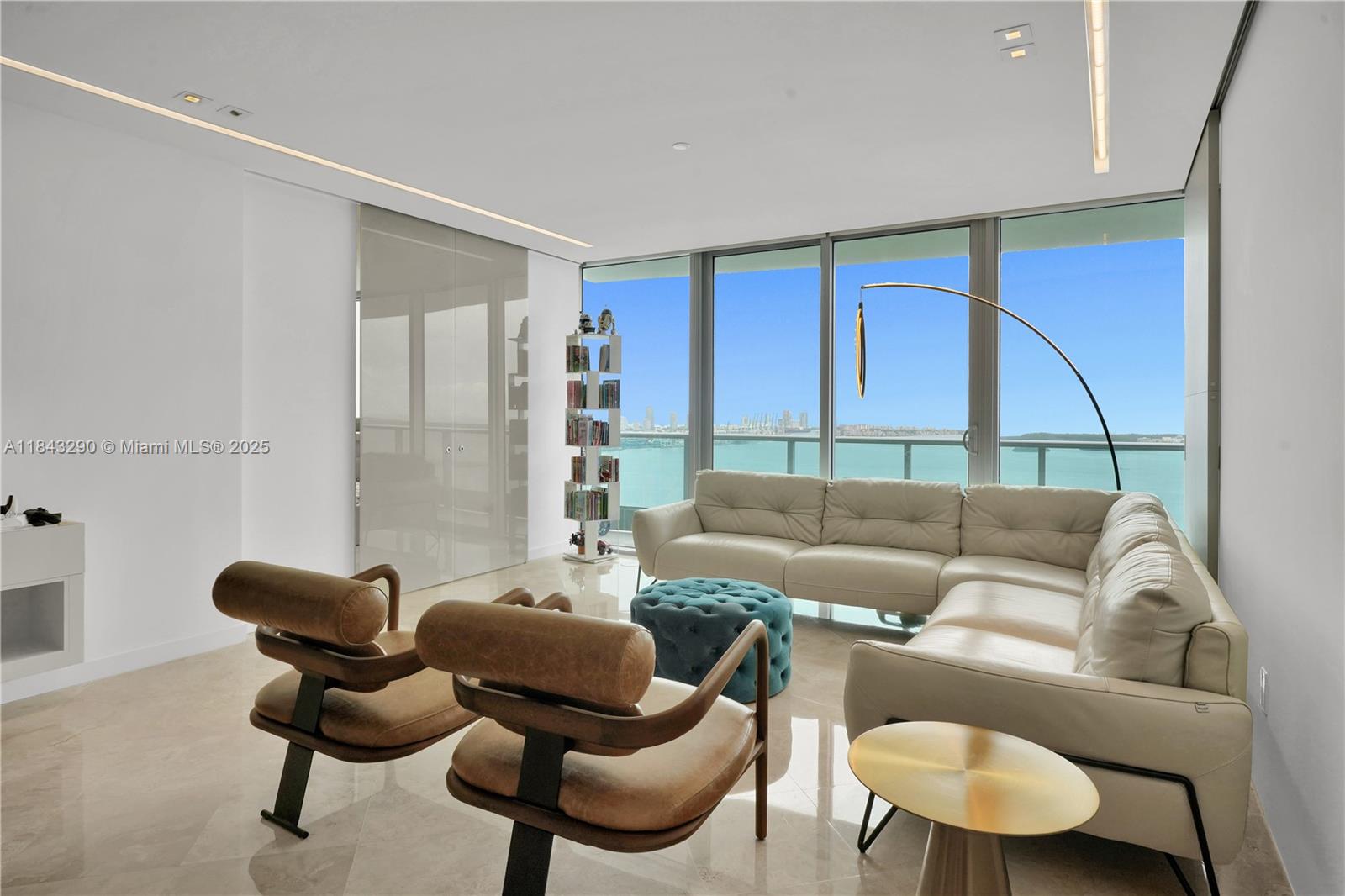 1331 Brickell Bay Drive, Unit 4303 Miami, FL 33131 - Photo 12 of 41 a living room with furniture and a large window