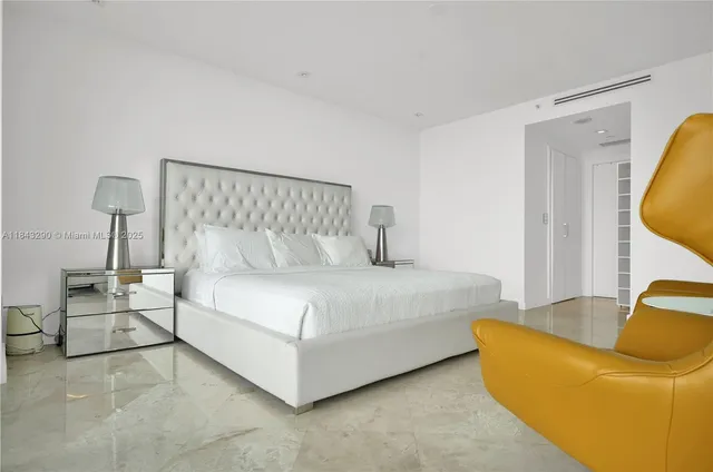 a bed room with a bed and a lamp