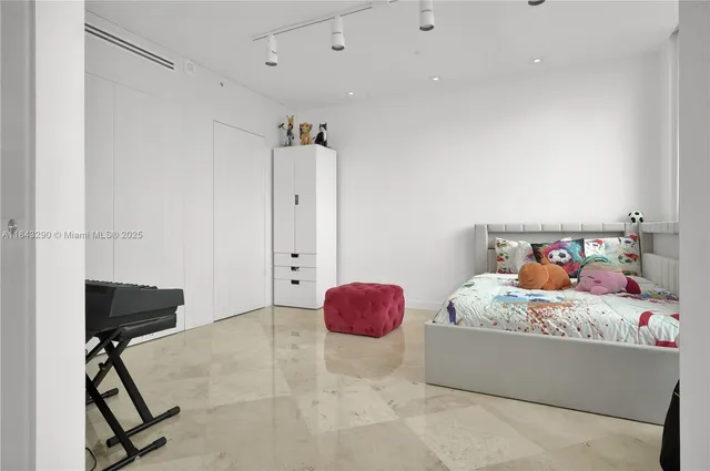 a kitchen with stainless steel appliances granite countertop a refrigerator a stove and a sink with wooden cabinets