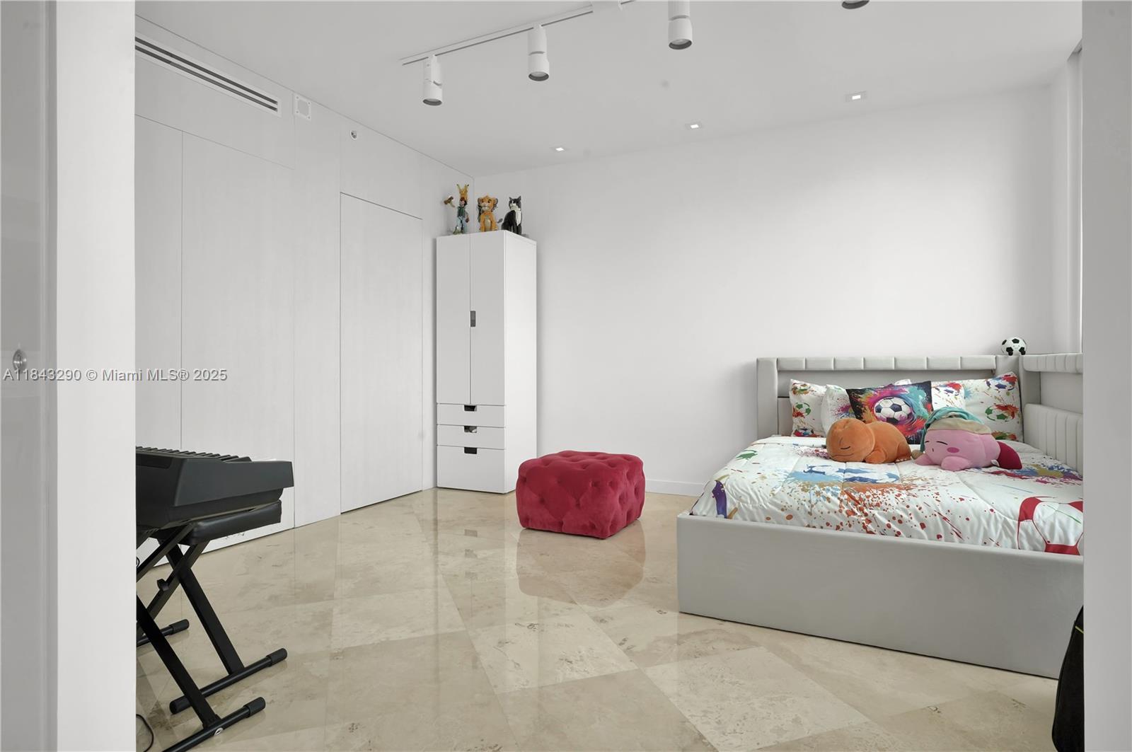 1331 Brickell Bay Drive, Unit 4303 Miami, FL 33131 - Photo 16 of 41 a bedroom with a bed and a chair