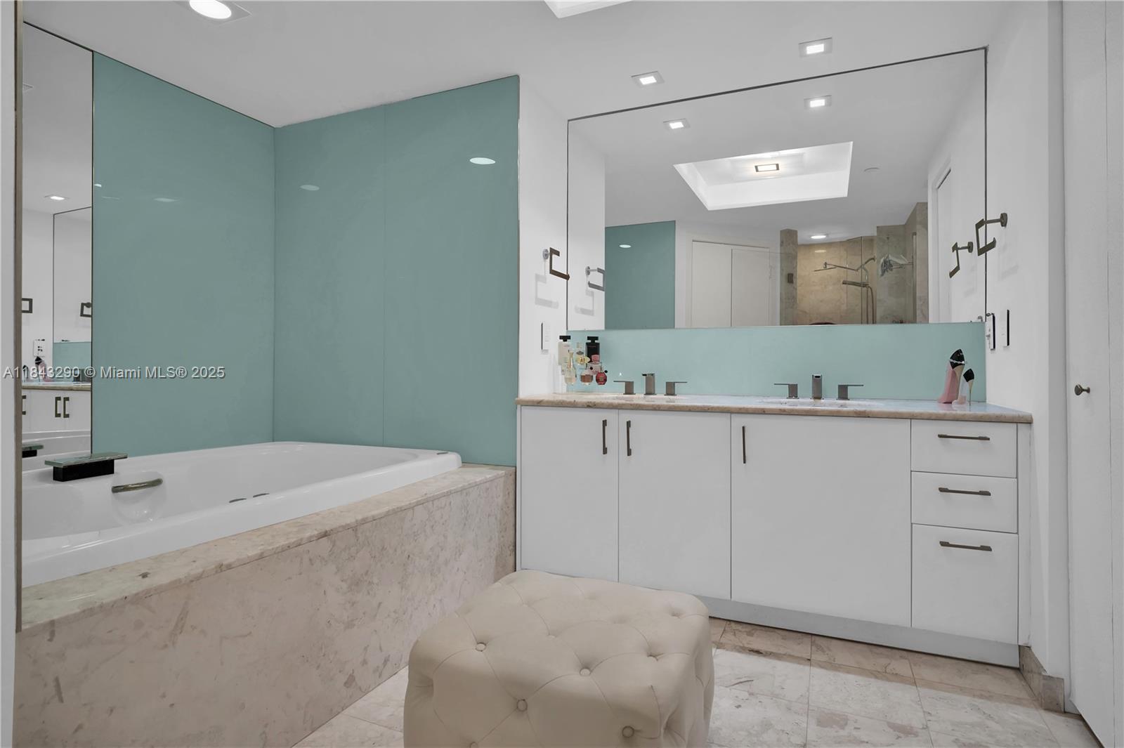 1331 Brickell Bay Drive, Unit 4303 Miami, FL 33131 - Photo 23 of 41 a bathroom with a sink a toilet and mirror