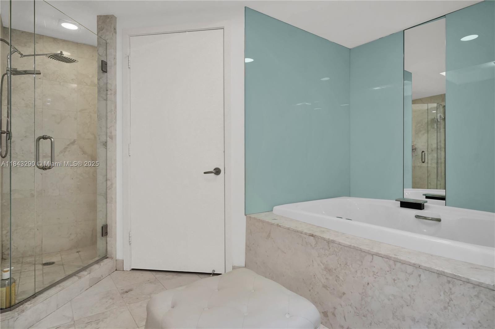 1331 Brickell Bay Drive, Unit 4303 Miami, FL 33131 - Photo 25 of 41 a bathroom with a granite countertop sink a shower and a mirror