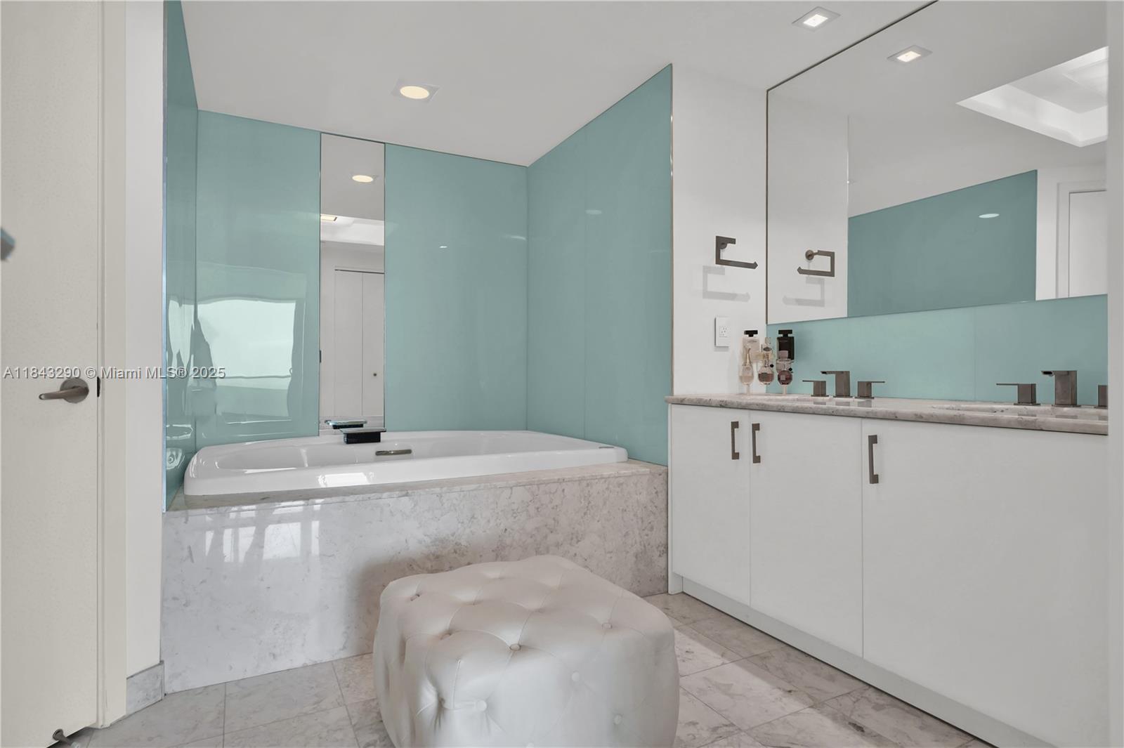 1331 Brickell Bay Drive, Unit 4303 Miami, FL 33131 - Photo 28 of 41 a bathroom with a sink a toilet and mirror