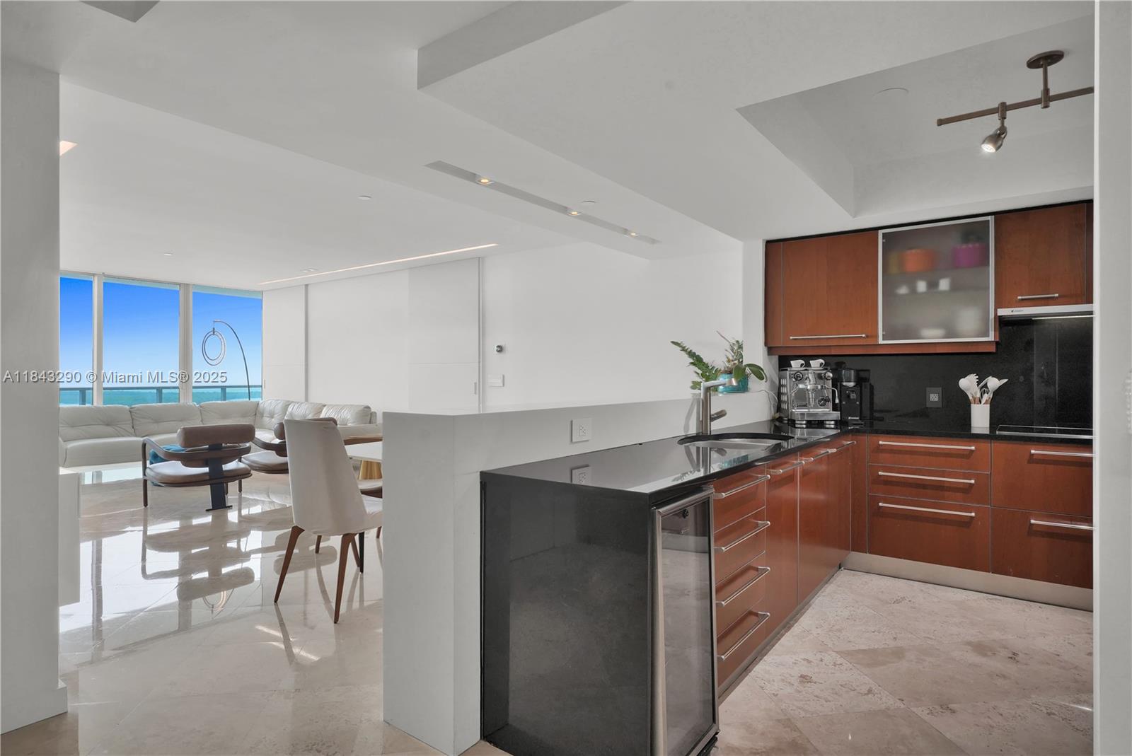 1331 Brickell Bay Drive, Unit 4303 Miami, FL 33131 - Photo 5 of 41 a kitchen with stainless steel appliances granite countertop sink stove and cabinets