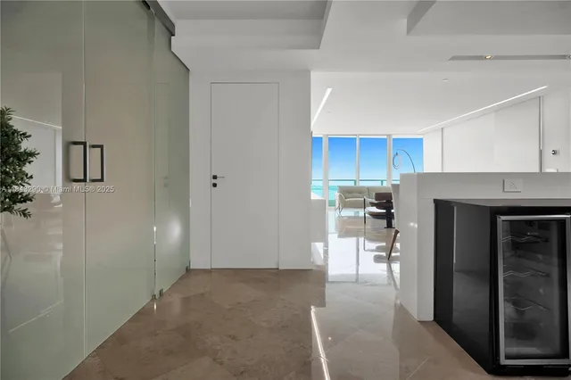 a kitchen with stainless steel appliances granite countertop a refrigerator and a stove