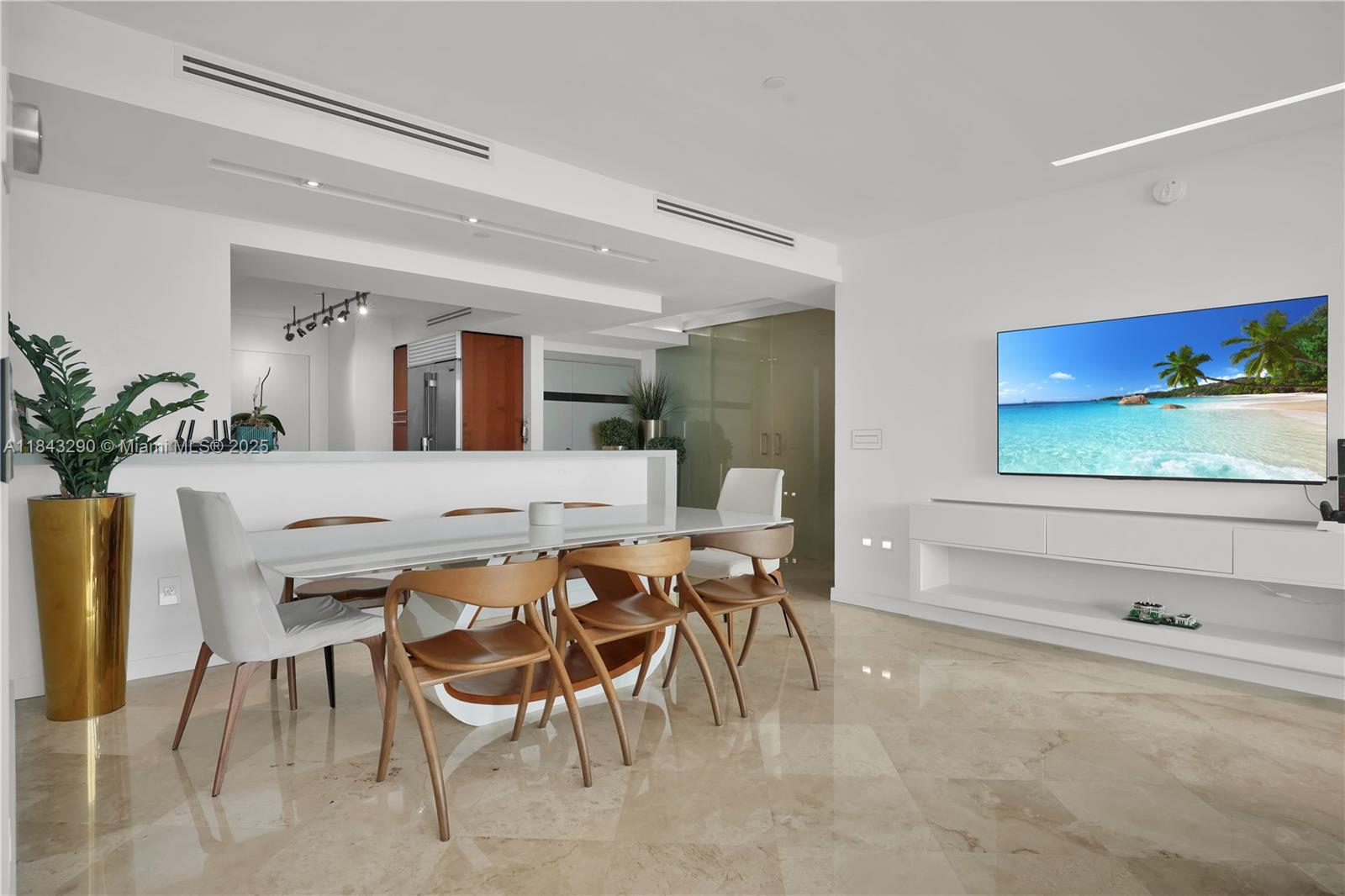 1331 Brickell Bay Drive, Unit 4303 Miami, FL 33131 - Photo 7 of 41 a view of a dining room with furniture and a potted plant
