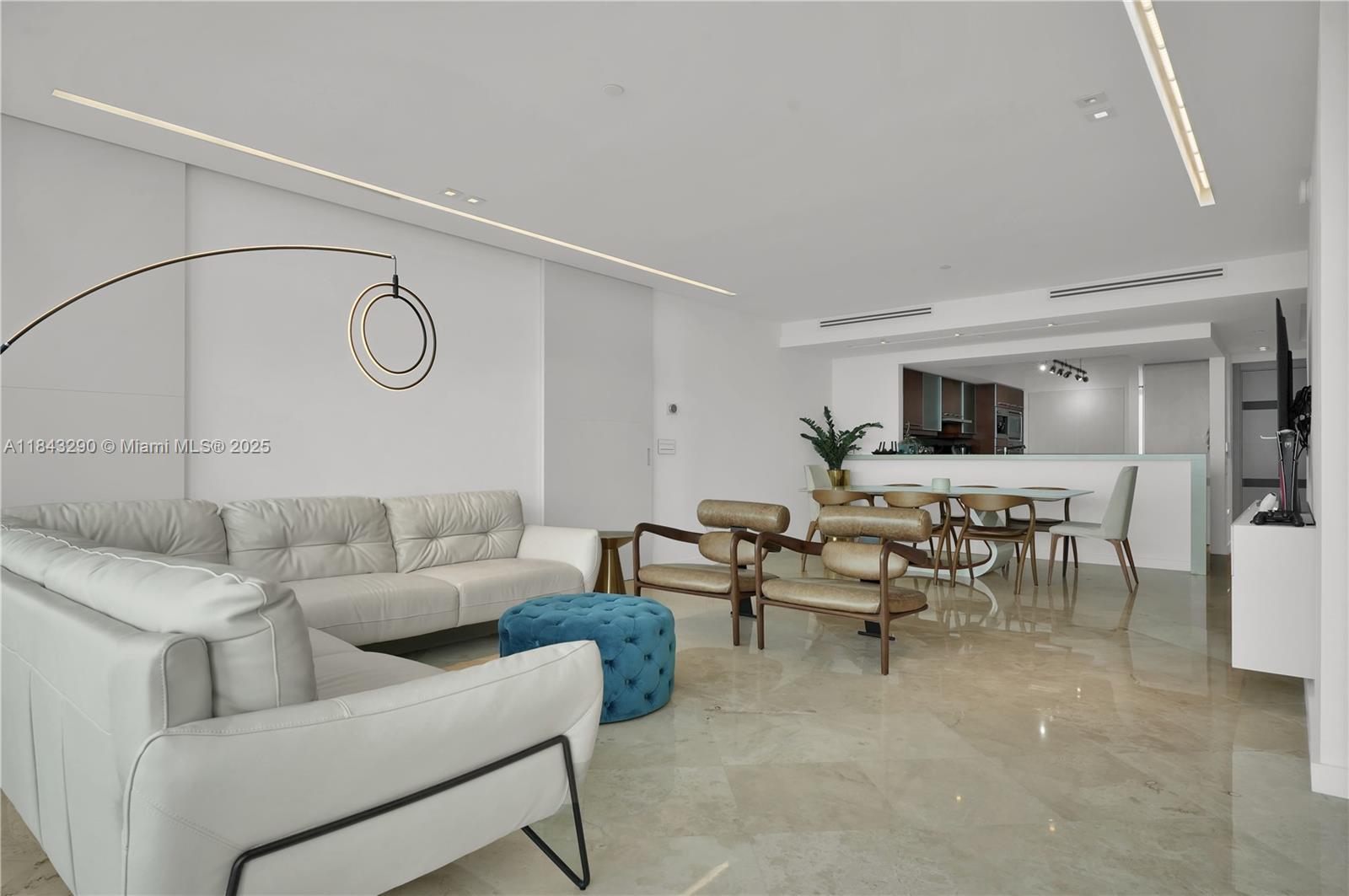 1331 Brickell Bay Drive, Unit 4303 Miami, FL 33131 - Photo 8 of 41 a living room with furniture and a clock