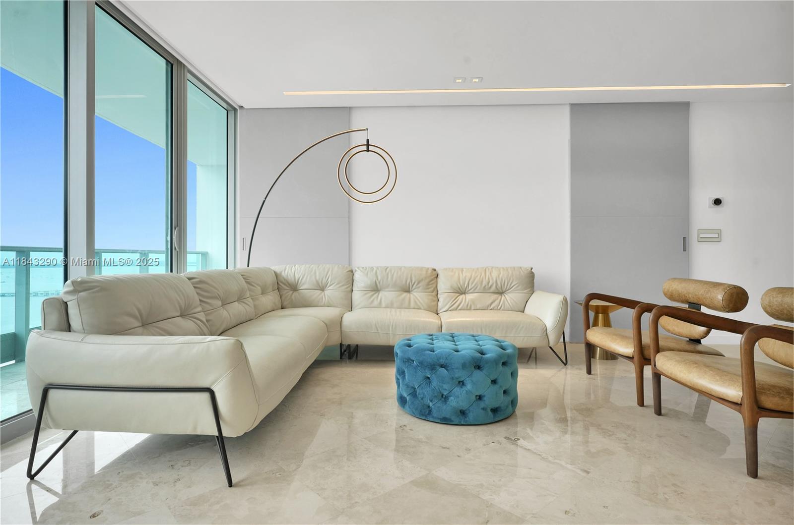 1331 Brickell Bay Drive, Unit 4303 Miami, FL 33131 - Photo 9 of 41 a living room with furniture and a large window