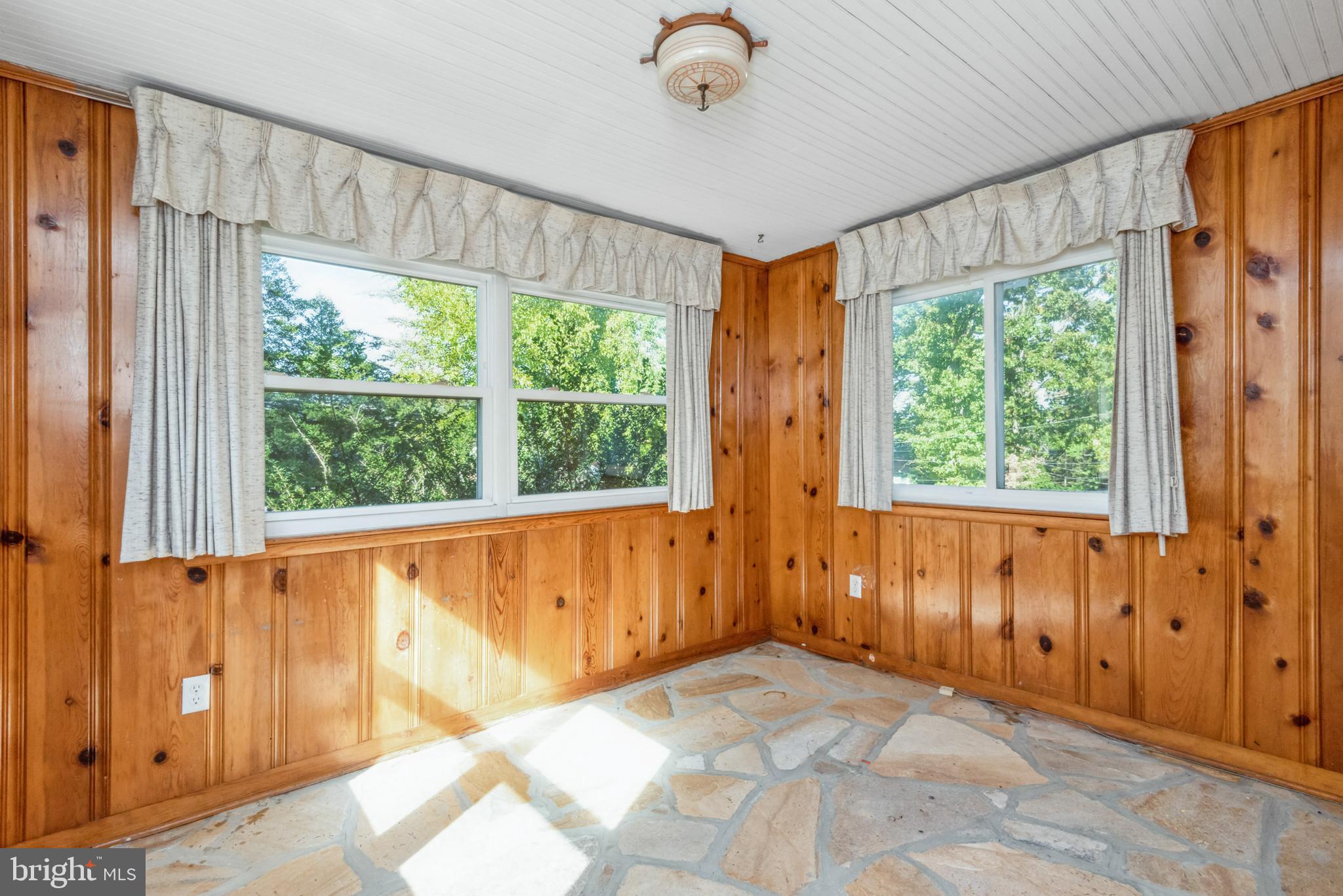 Sunroom with flagstone floor