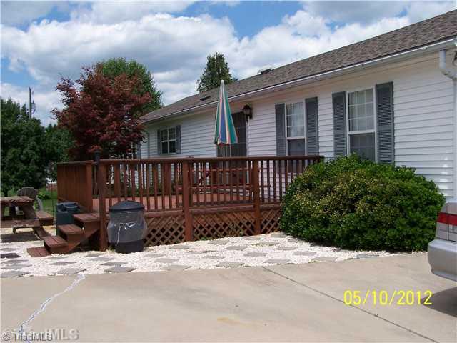 1166 Ridge Road Pine Hall, NC 27042 - Photo 4 of 16 Exterior Back. Large Deck and Patio outback.