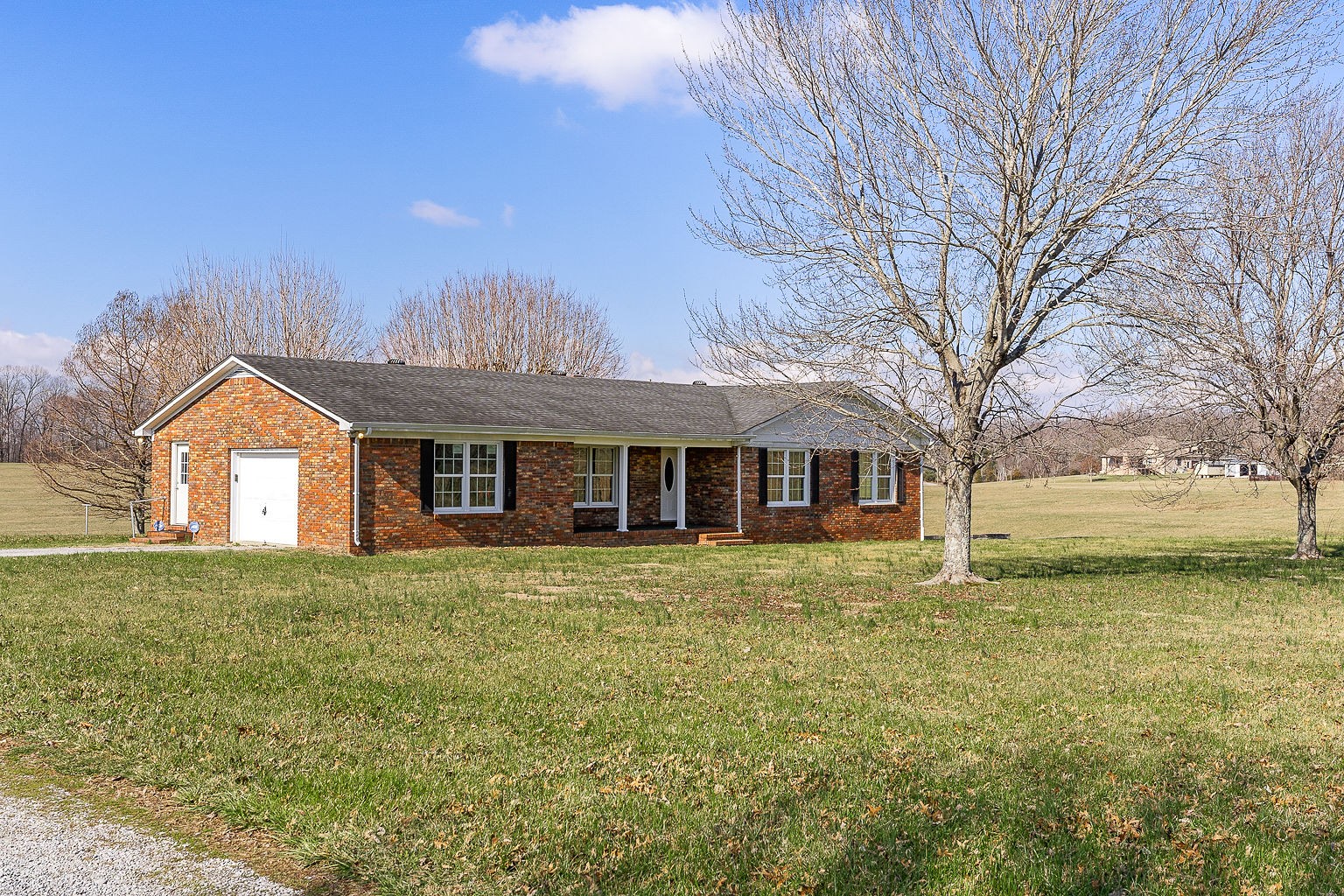 6401 Lucky Road McMinnville, TN 37110 - Photo 20 of 50 a front view of a house with a yard