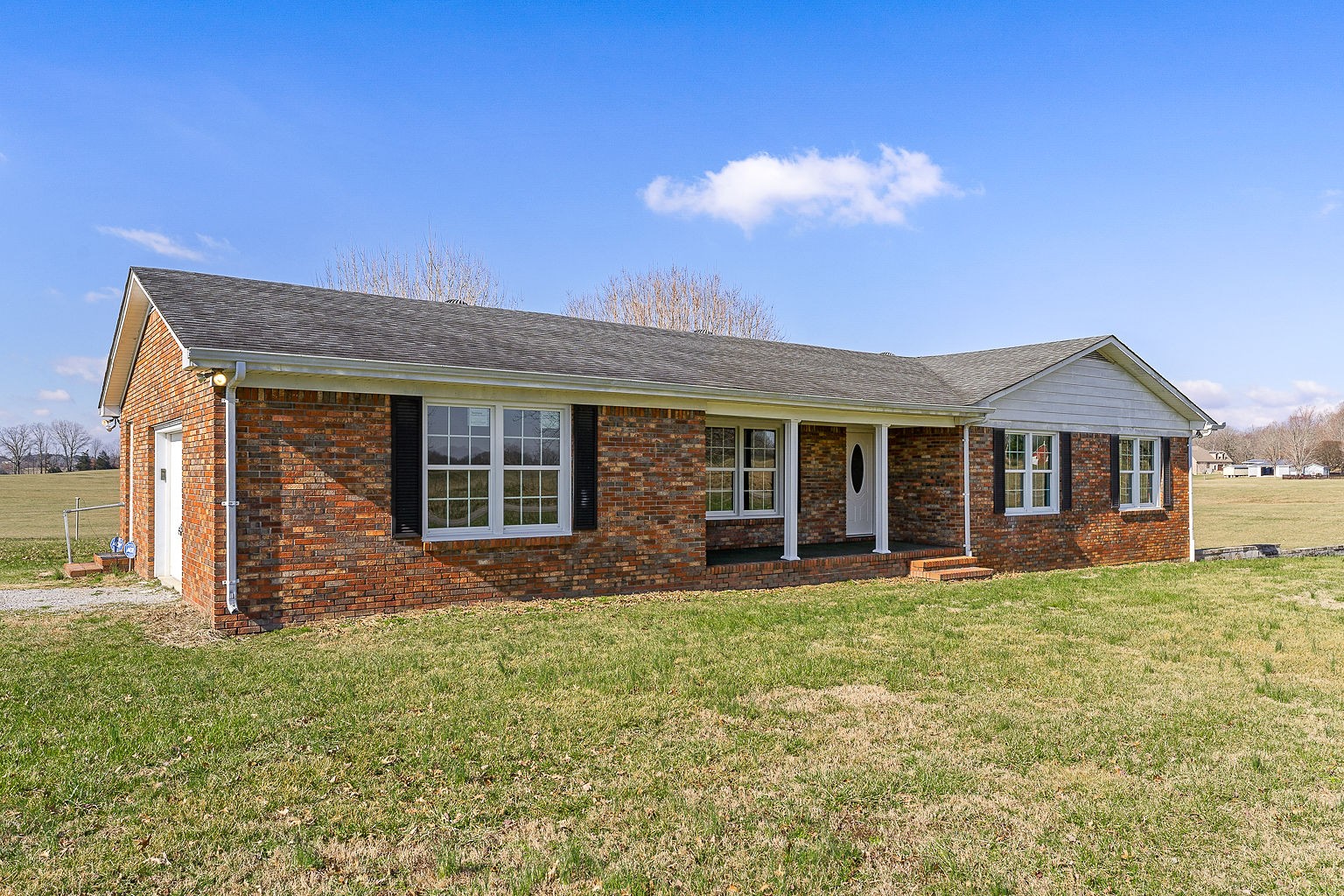6401 Lucky Road McMinnville, TN 37110 - Photo 21 of 50 a front view of a house with a yard