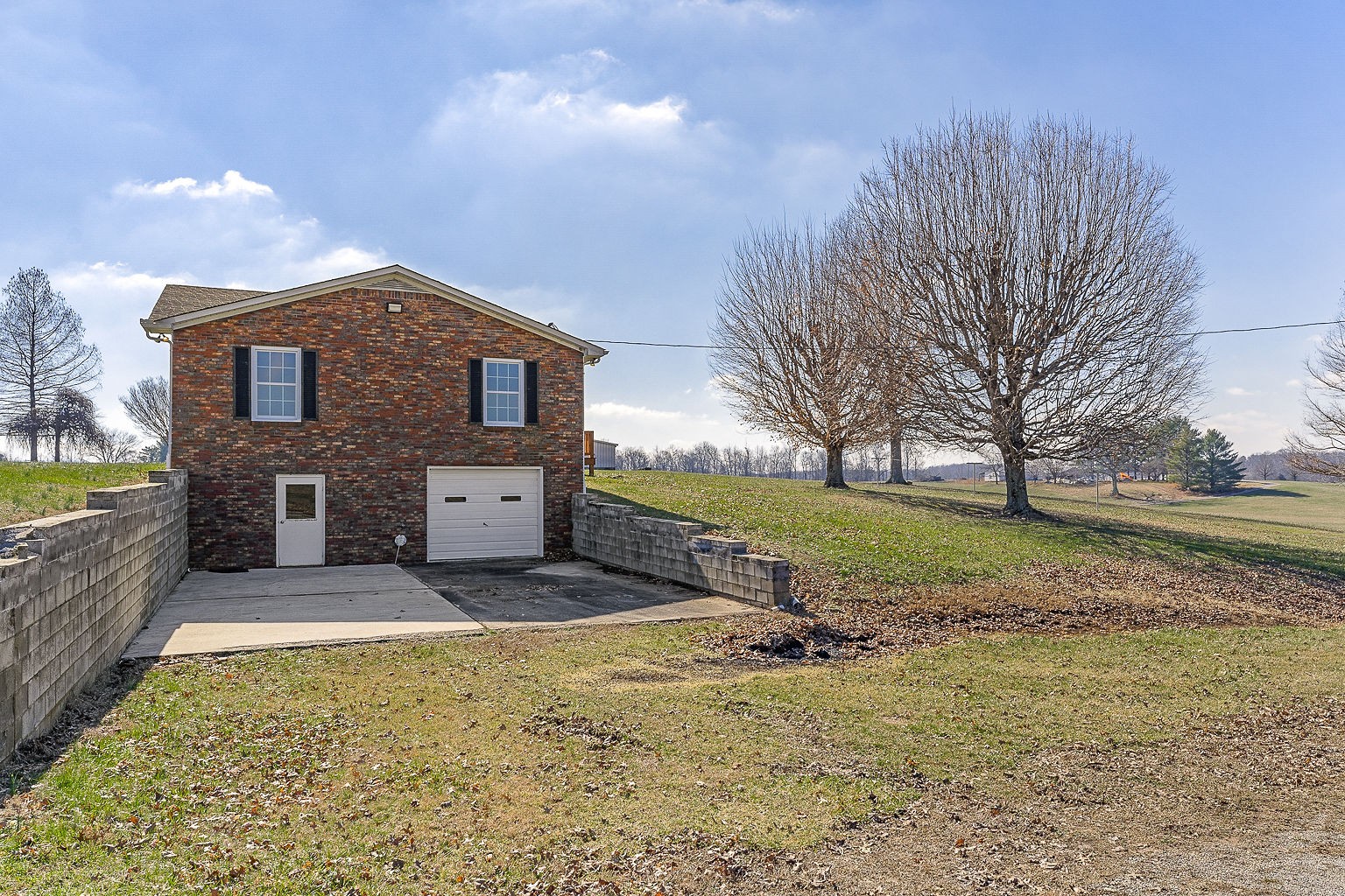 6401 Lucky Road McMinnville, TN 37110 - Photo 24 of 50 a front view of a house with a yard
