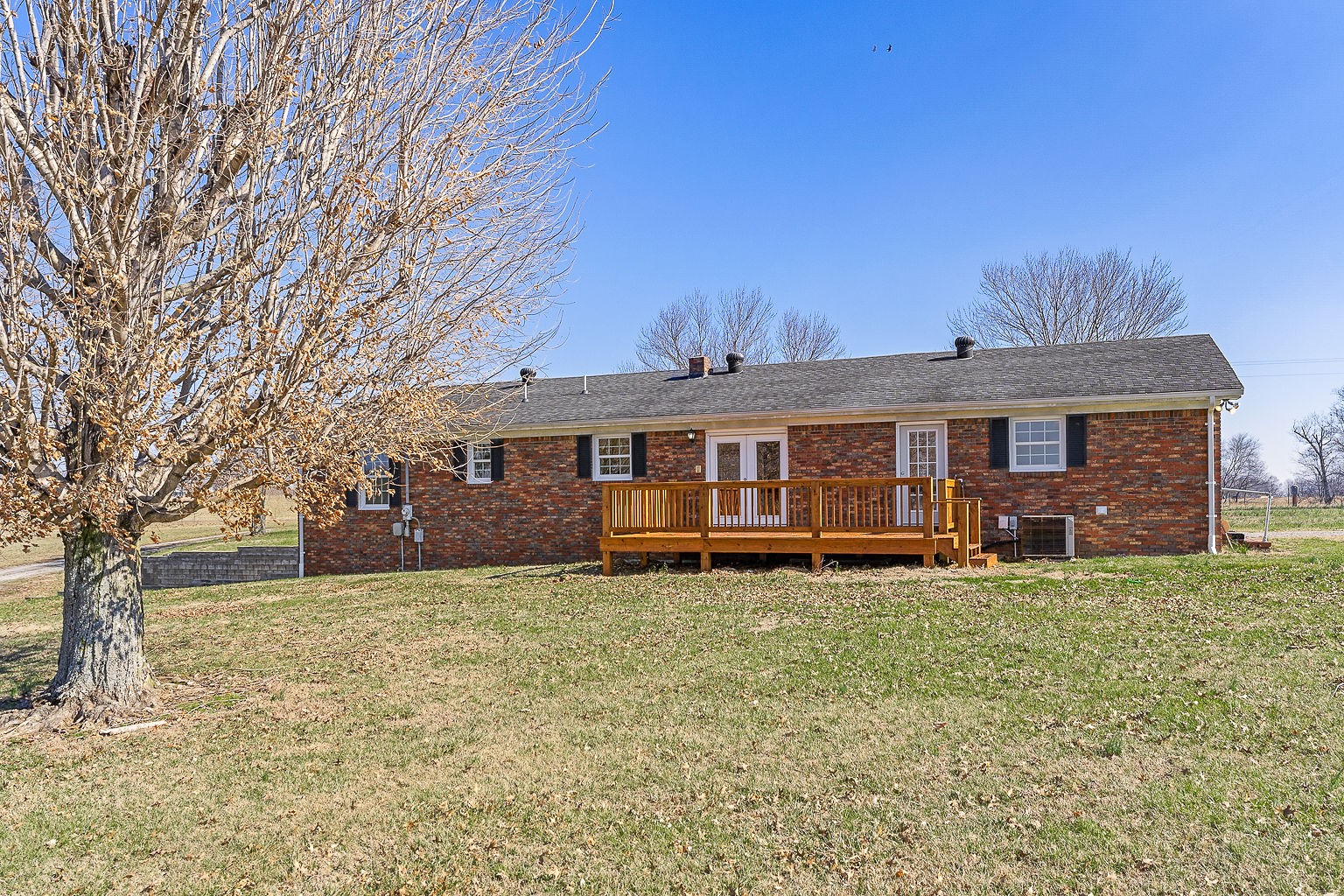 6401 Lucky Road McMinnville, TN 37110 - Photo 25 of 50 a view of a yard in front of a house with large trees