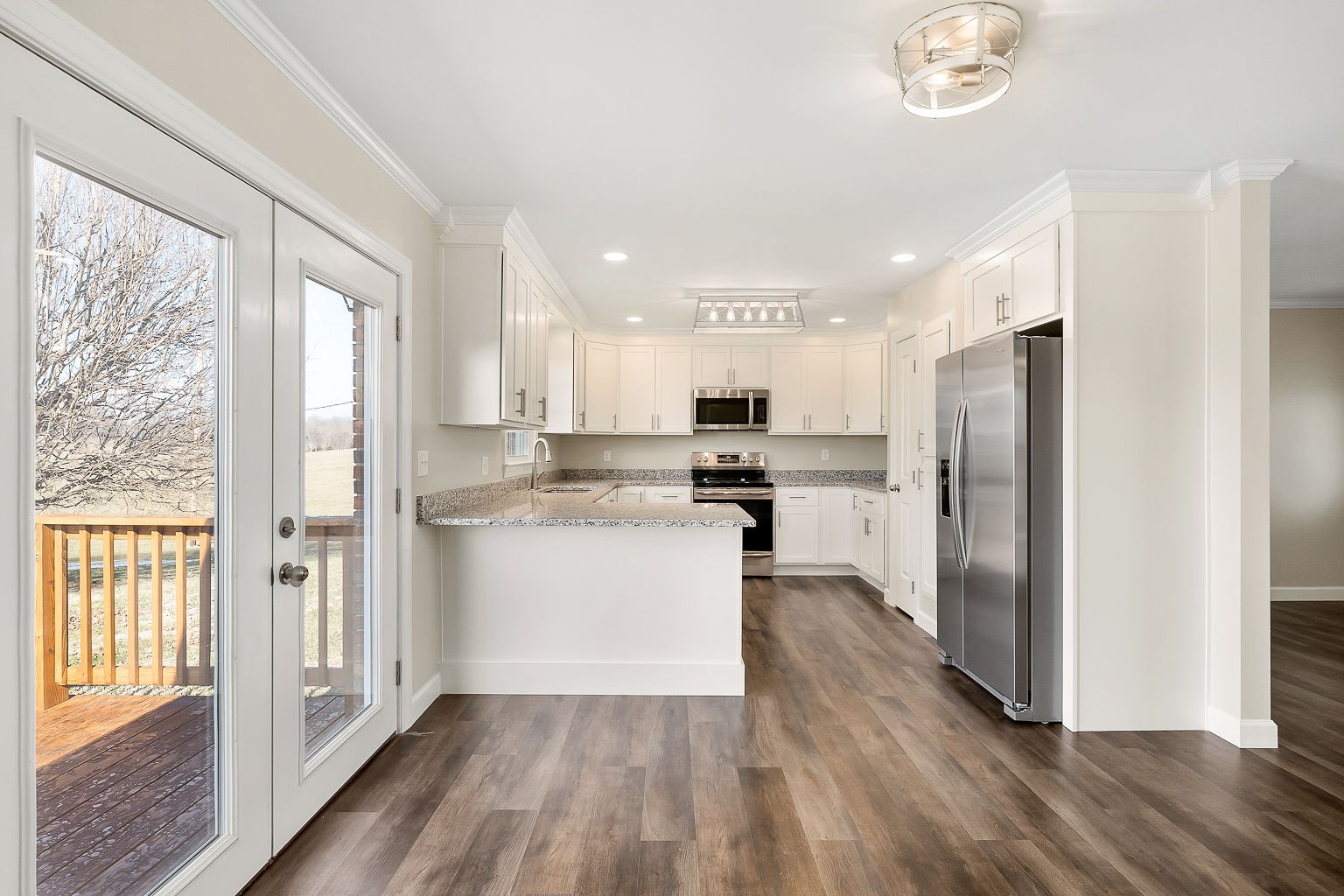 6401 Lucky Road McMinnville, TN 37110 - Photo 41 of 50 a kitchen with a refrigerator a sink and cabinets