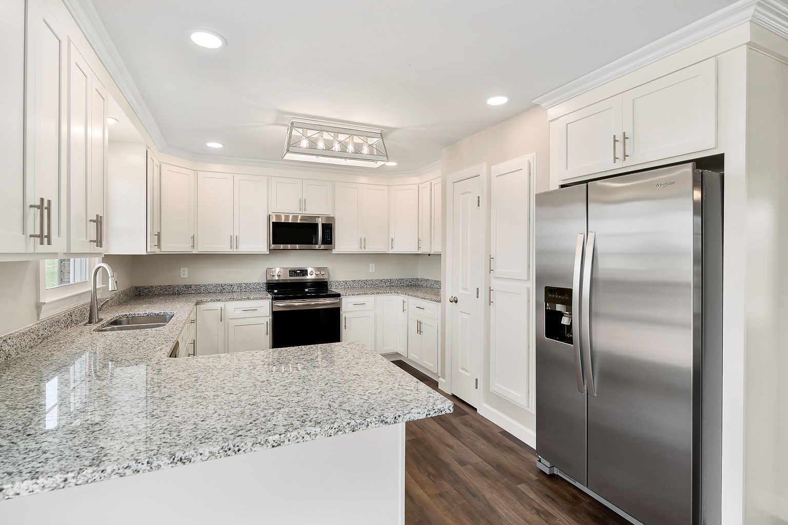 6401 Lucky Road McMinnville, TN 37110 - Photo 42 of 50 a kitchen with granite countertop a refrigerator and a sink