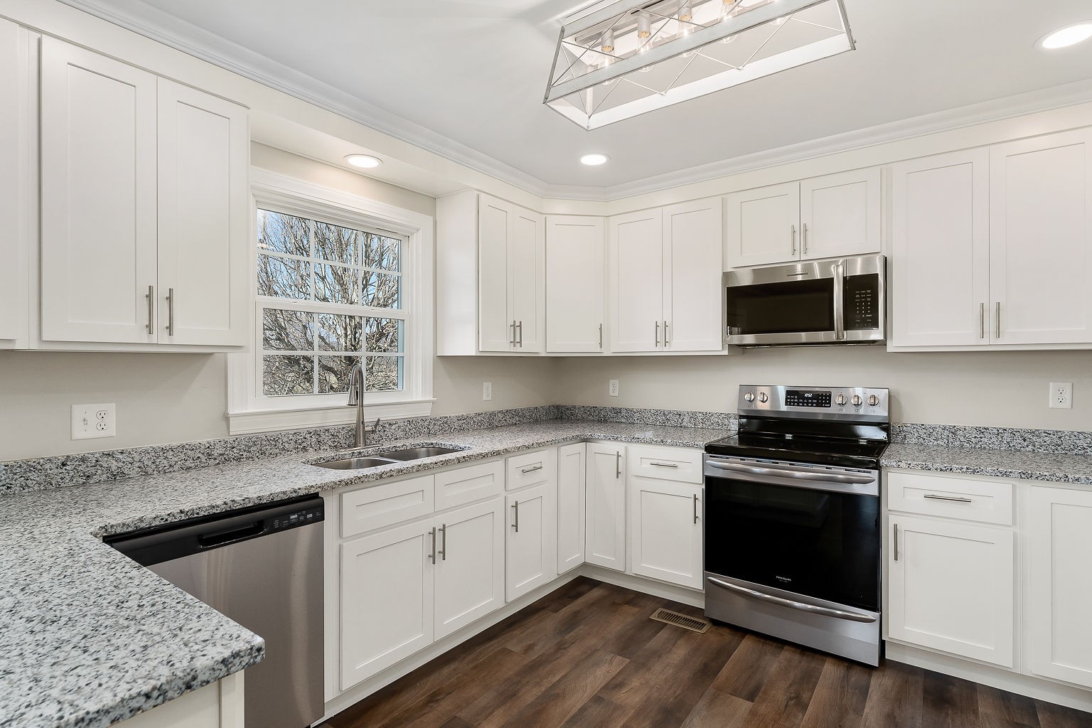 6401 Lucky Road McMinnville, TN 37110 - Photo 43 of 50 a kitchen with granite countertop white cabinets and a stove