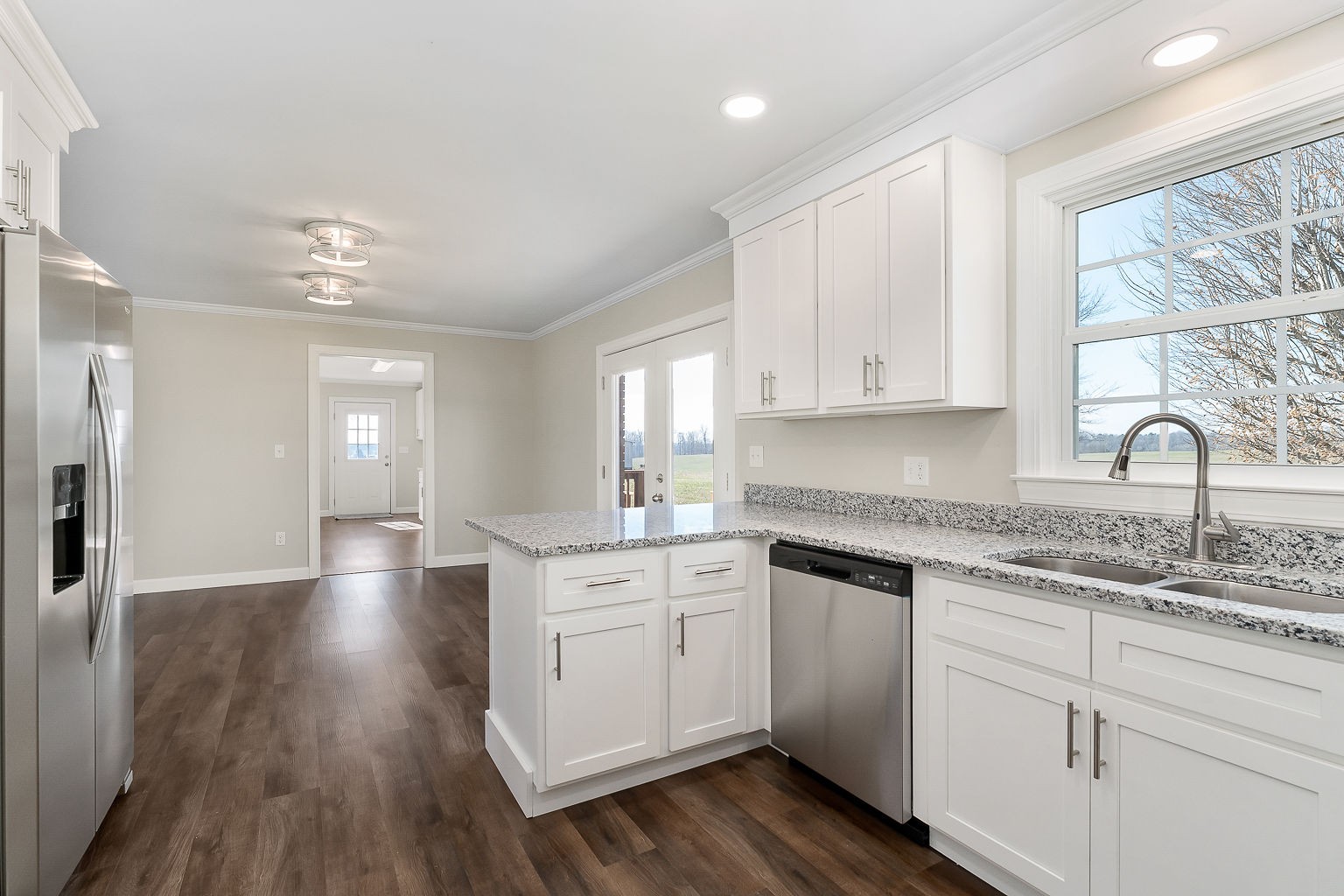 6401 Lucky Road McMinnville, TN 37110 - Photo 44 of 50 a kitchen with sink cabinets and wooden floor