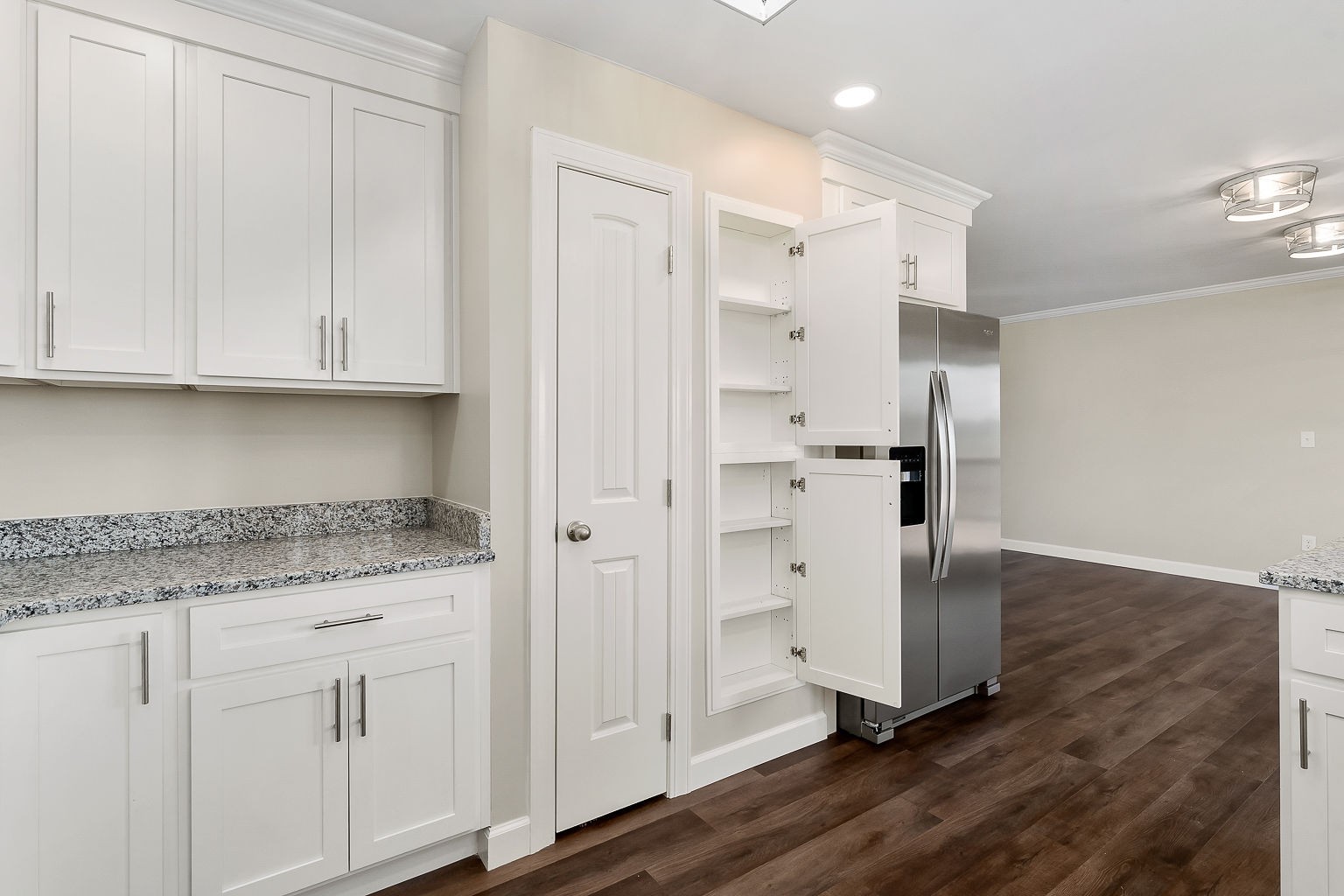 6401 Lucky Road McMinnville, TN 37110 - Photo 45 of 50 a kitchen with white cabinets and refrigerator
