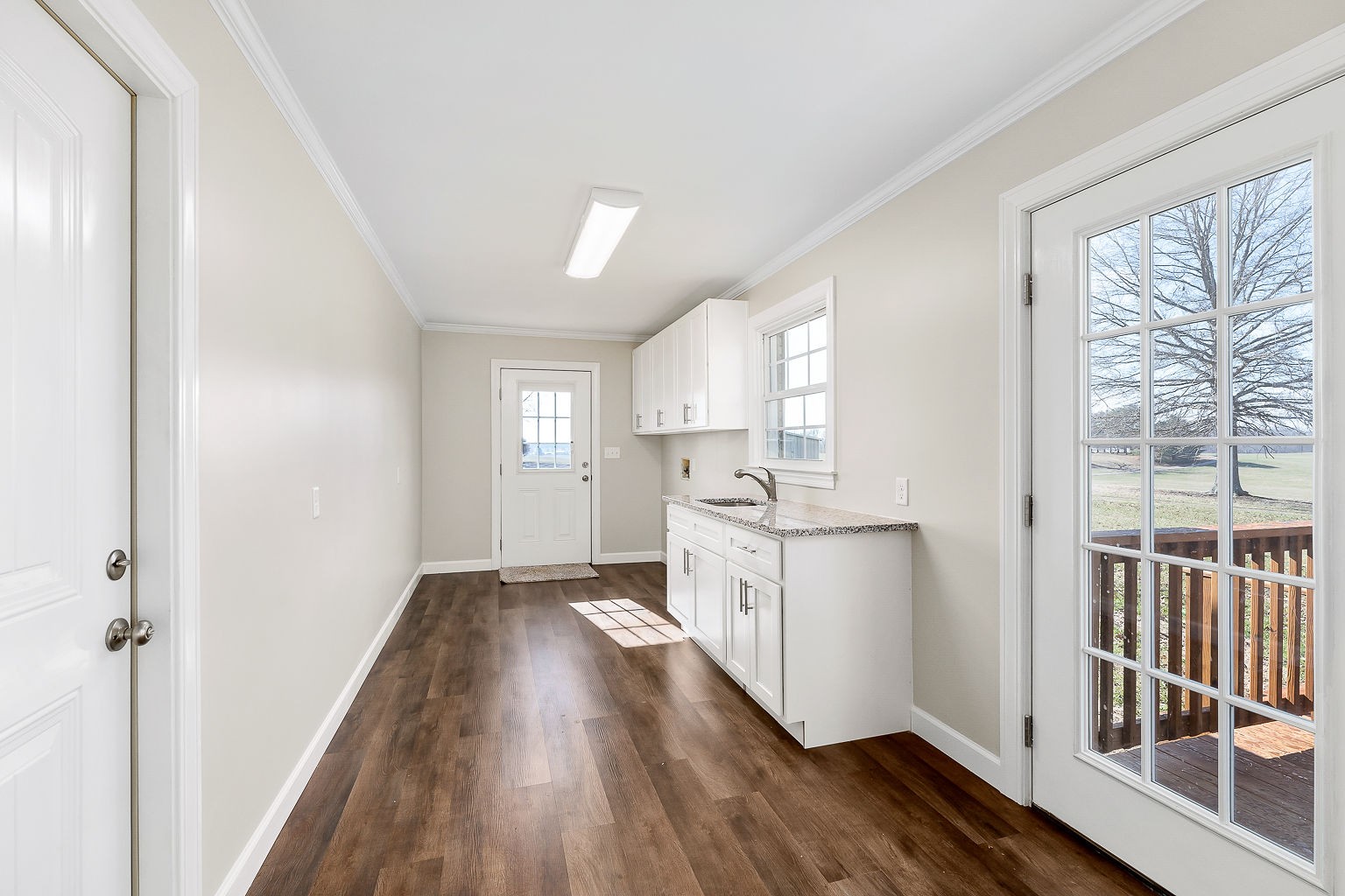6401 Lucky Road McMinnville, TN 37110 - Photo 46 of 50 a kitchen with granite countertop a stove top oven sink and window