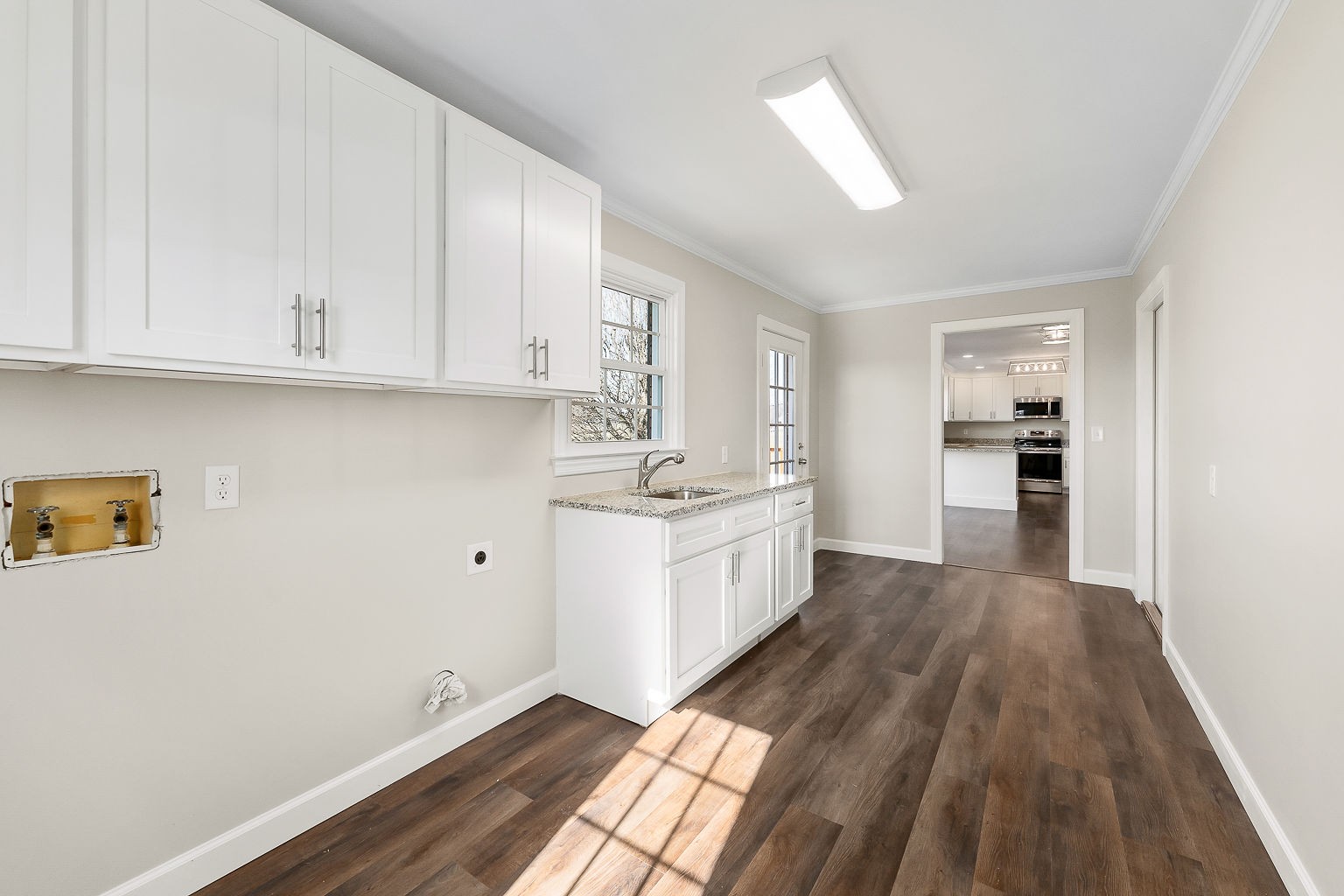 6401 Lucky Road McMinnville, TN 37110 - Photo 47 of 50 a kitchen with granite countertop white cabinets and white appliances