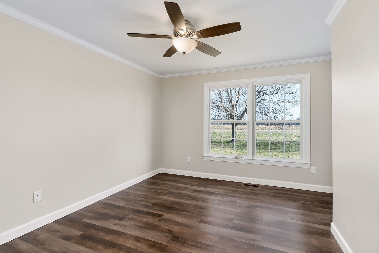 6401 Lucky Road McMinnville, TN 37110 - Photo 49 of 50 an empty room with wooden floor fan and windows
