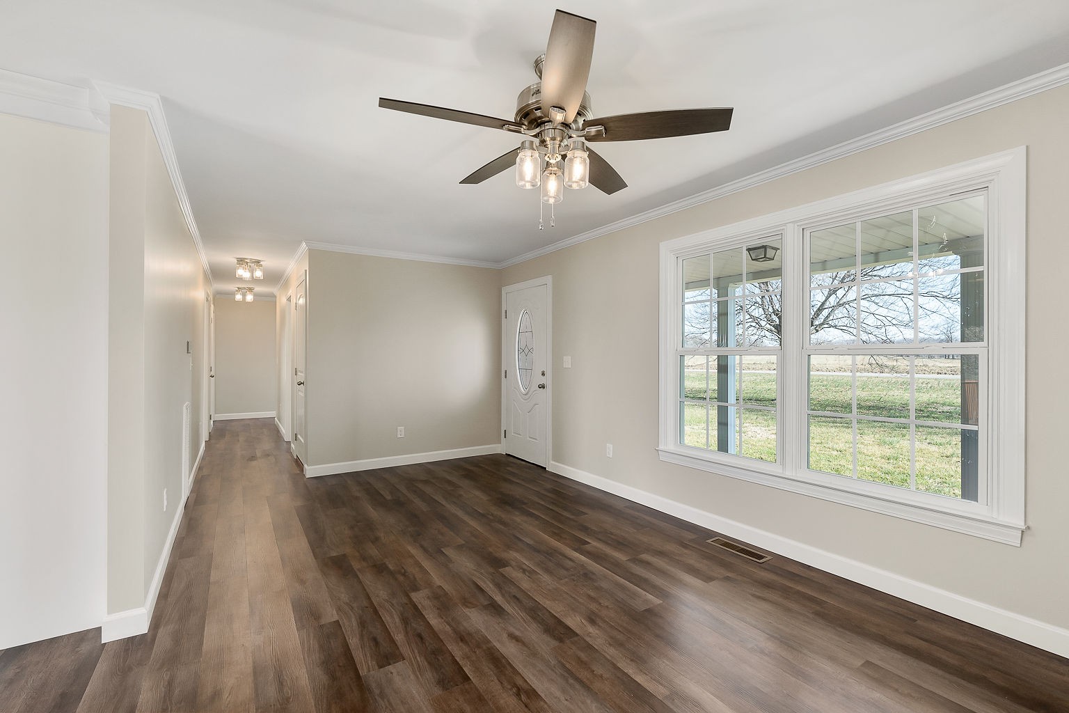 6401 Lucky Road McMinnville, TN 37110 - Photo 8 of 50 a view of an empty room with wooden floor and a window