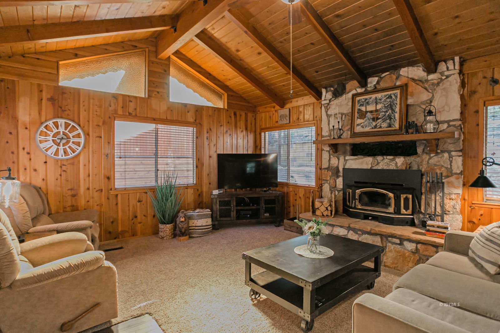 52507 Sylvan Way Idyllwild, CA 92549 - Photo 14 of 43 a living room with furniture a flat screen tv and a fireplace