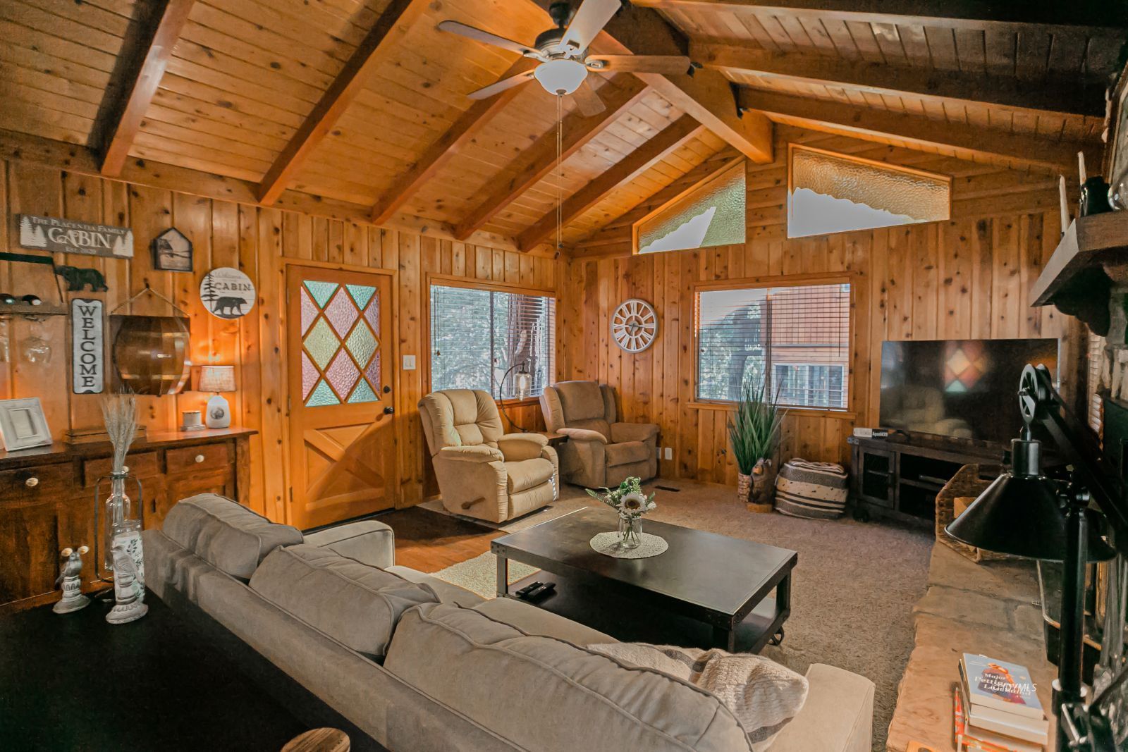52507 Sylvan Way Idyllwild, CA 92549 - Photo 16 of 43 a living room with furniture and a flat screen tv