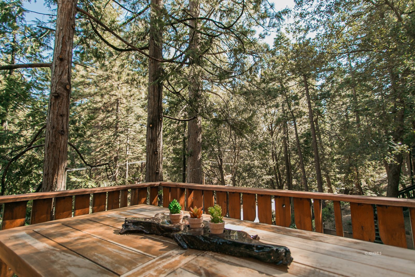 52507 Sylvan Way Idyllwild, CA 92549 - Photo 4 of 43 a view of balcony with wooden floor and fence