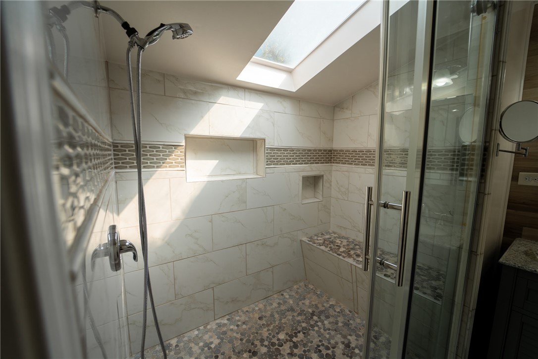 1985 Laguna Road Mohave Valley, AZ 86440 - Photo 31 of 83 The shower features a skylight, glass enclosure, and a tiled bench