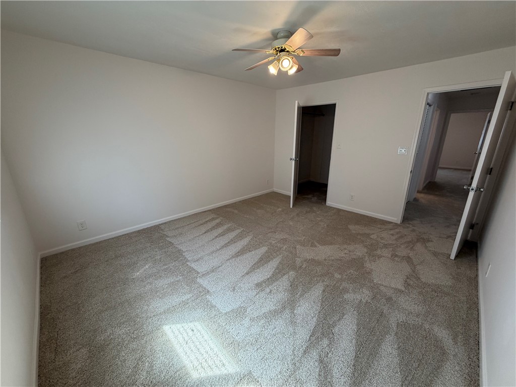 1985 Laguna Road Mohave Valley, AZ 86440 - Photo 38 of 83 Unfurnished bedroom with light colored carpet and a ceiling fan