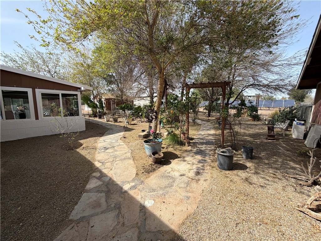 1985 Laguna Road Mohave Valley, AZ 86440 - Photo 59 of 83 View of yard with a sunroom and a patio area