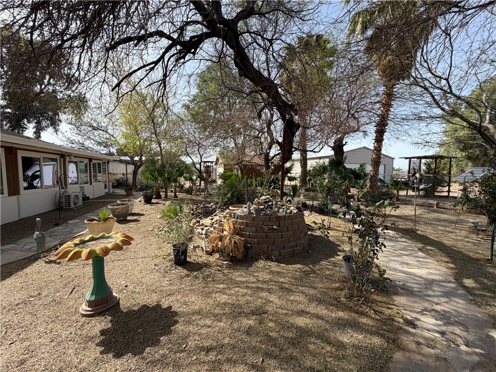 1985 Laguna Road Mohave Valley, AZ 86440 - Photo 61 of 83 View of yard featuring a sunroom and a patio area