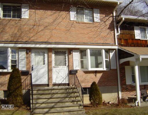 260 Edgemoor Road, Unit G Bridgeport, CT 06606 - Photo 1 of 1 a front view of a house with large windows