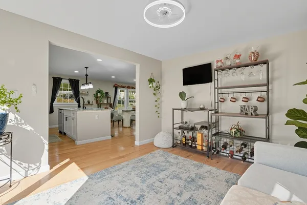 a living room with furniture and flat screen tv