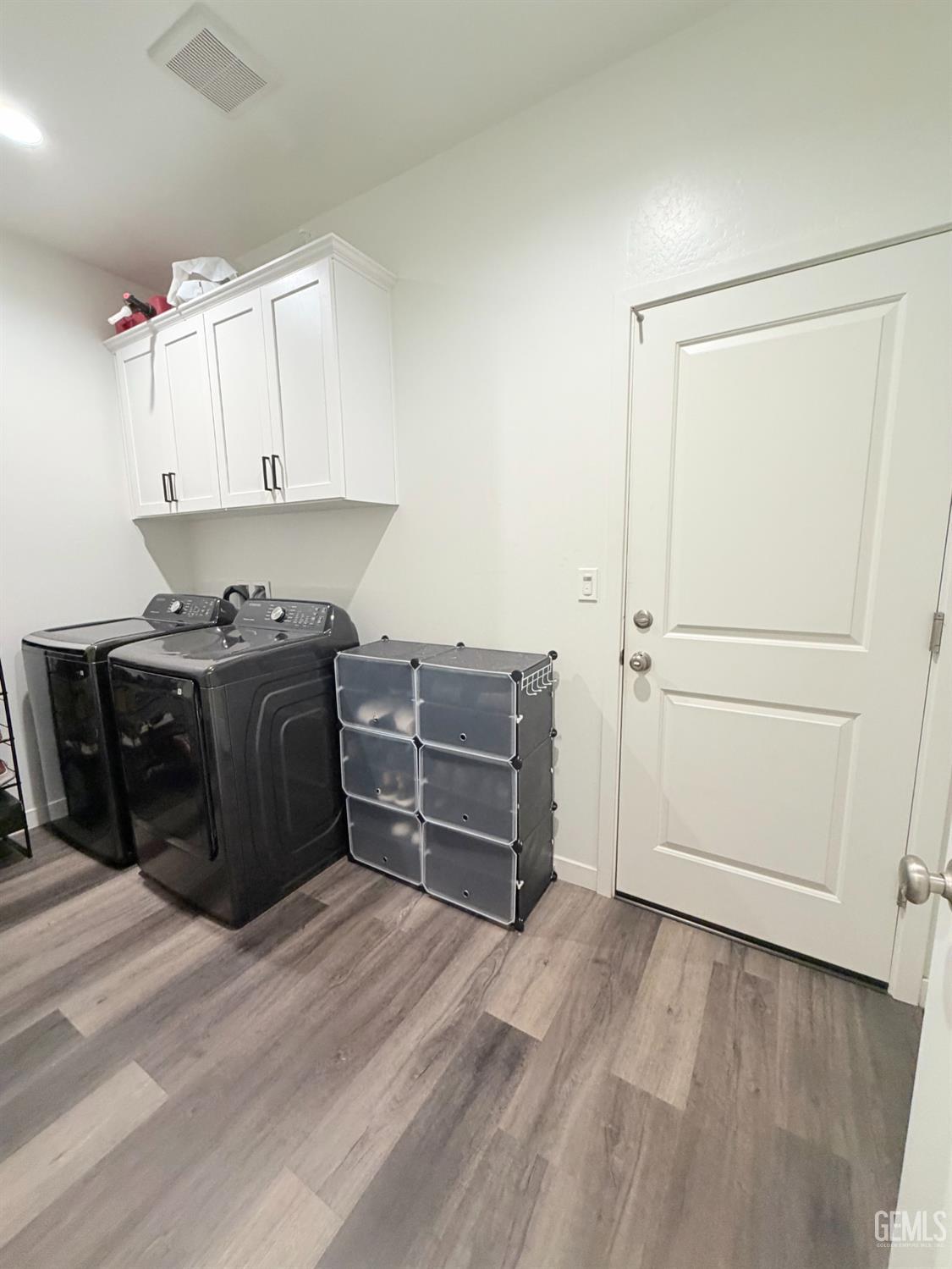 Undisclosed Address Bakersfield, CA 93313 - Photo 22 of 24 a room with a cabinets and a bed